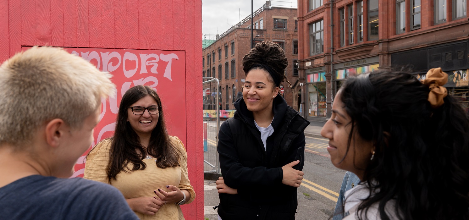 Young people meeting outside a board meeting